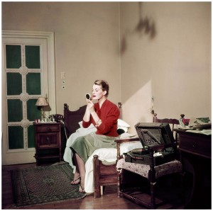 Robert Capa, [Capucine, French model and actress, in her hotel room, Rome], August 1951. © Robert Capa/International Center of Photography/Magnum Photos.