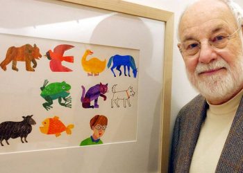 AMHERST, MA - NOVEMBER 13: Artist Eric Carle, an illustrator and author of children's books, with his work from the book, "The Mixed Up Chameleon." Carle was instrumental in the planning and building of the museum. (Photo by Matthew J. Lee/The Boston Globe via Getty Images)